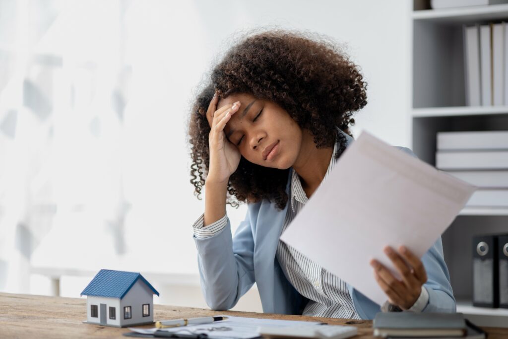 woman overwhelmed with the decisions she has to make when thinking about refinancing her mortgage